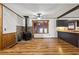 Inviting living area with a charming stone fireplace, wood floors, and ample natural light at 4009 Highway 138 Sw, Stockbridge, GA 30281