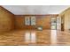 Spacious living room with hardwood floors and lots of natural light coming through the window and door at 4009 Highway 138 Sw, Stockbridge, GA 30281