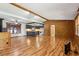 Spacious living area featuring wood floors, a stone fireplace, and an open layout at 4009 Highway 138 Sw, Stockbridge, GA 30281