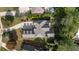 Aerial view of a grand home with a multi-car driveway and mature landscaping at 1734 Doonbeg Ct, Kennesaw, GA 30152