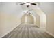 Spacious attic area featuring neutral carpeting, multiple ceiling fans, and abundant natural light at 1734 Doonbeg Ct, Kennesaw, GA 30152