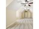 Large attic space with neutral carpet and multiple ceiling fans, perfect for storage or expansion at 1734 Doonbeg Ct, Kennesaw, GA 30152