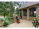 Outdoor deck featuring a modern grill, perfect for entertaining with backyard views at 1734 Doonbeg Ct, Kennesaw, GA 30152