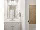 Bathroom featuring vanity, mirror, bathtub with tile surround, toilet and tile flooring at 1734 Doonbeg Ct, Kennesaw, GA 30152