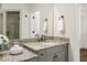 Bathroom vanity with double sink, granite counters and cabinet storage at 1734 Doonbeg Ct, Kennesaw, GA 30152