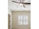 Bedroom featuring plantation shutters on the windows and a lighted ceiling fan at 1734 Doonbeg Ct, Kennesaw, GA 30152