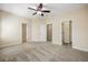 Bedroom with carpet and multiple doorways at 1734 Doonbeg Ct, Kennesaw, GA 30152