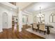 Bright dining room featuring hardwood floors, chandelier lighting, and classic architectural details at 1734 Doonbeg Ct, Kennesaw, GA 30152