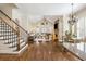 Open-concept living space connects the staircase, living room and dining, with hardwood floors throughout at 1734 Doonbeg Ct, Kennesaw, GA 30152