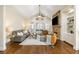Spacious living room featuring vaulted ceilings, stone fireplace, and hardwood flooring at 1734 Doonbeg Ct, Kennesaw, GA 30152