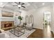 Inviting living room with a stone fireplace and plenty of natural light at 1734 Doonbeg Ct, Kennesaw, GA 30152