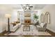 Cozy living room with coffered ceilings, a stone fireplace, and neutral decor at 1734 Doonbeg Ct, Kennesaw, GA 30152