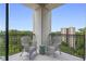 Balcony featuring chairs and a view of trees and a building in the distance at 2828 Peachtree Nw Rd # 903, Atlanta, GA 30305