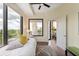Bright bedroom with ensuite bathroom featuring a large window with city views and minimalist decor at 2828 Peachtree Nw Rd # 903, Atlanta, GA 30305