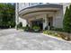 An elegant entrance features a roundabout drive and well-manicured landscaping at 2828 Peachtree Nw Rd # 903, Atlanta, GA 30305