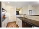 Kitchen featuring stainless steel appliances, white cabinets and a breakfast bar with seating at 2828 Peachtree Nw Rd # 903, Atlanta, GA 30305