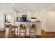 Bright kitchen with modern black appliances, breakfast bar, pendant lighting and an open floor plan at 2828 Peachtree Nw Rd # 903, Atlanta, GA 30305