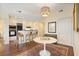 Modern open-concept kitchen and dining area with stainless steel appliances and breakfast bar seating at 2828 Peachtree Nw Rd # 903, Atlanta, GA 30305