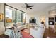 Open living room with large windows, comfortable seating, stylish decor, and view to kitchen area at 2828 Peachtree Nw Rd # 903, Atlanta, GA 30305