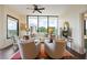 Living Room with hardwood floors, a ceiling fan, and expansive windows offering natural light at 2828 Peachtree Nw Rd # 903, Atlanta, GA 30305