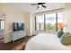 Bright bedroom featuring a large window, comfortable furniture, and ensuite bathroom at 2828 Peachtree Nw Rd # 903, Atlanta, GA 30305