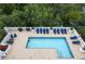 A beautiful rooftop pool with lounge chairs and lush greenery surrounds it at 2828 Peachtree Nw Rd # 903, Atlanta, GA 30305