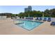 A sparkling pool features lounge chairs and umbrellas for relaxation at 2828 Peachtree Nw Rd # 903, Atlanta, GA 30305