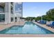 Enjoy this outdoor swimming pool with relaxing lounge chairs and lush greenery around at 2828 Peachtree Nw Rd # 903, Atlanta, GA 30305