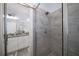 Bathroom featuring a shower and gray tile at 3576 Sexton Woods Dr, Chamblee, GA 30341