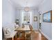 Bright breakfast nook with tufted bench seating, wood table, and large window view at 3576 Sexton Woods Dr, Chamblee, GA 30341