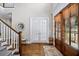 Foyer showcasing hardwood floors, a staircase, and view of front doors with sidelight windows at 3576 Sexton Woods Dr, Chamblee, GA 30341