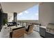 Relax on this condo's balcony, featuring stylish outdoor furniture, a grill and fantastic views at 2425 Peachtree Ne Rd # 1604, Atlanta, GA 30305