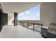 Enjoy expansive city views from this condo's covered balcony with glass railing and modern outdoor grill at 2425 Peachtree Ne Rd # 1604, Atlanta, GA 30305