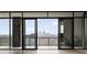 Balcony view showcasing the city skyline through the large sliding glass doors at 2425 Peachtree Ne Rd # 1604, Atlanta, GA 30305