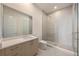 Modern bathroom features a walk-in shower with glass enclosure, vanity with sink, and neutral finishes at 2425 Peachtree Ne Rd # 1604, Atlanta, GA 30305