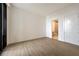 Bright and airy bedroom features hardwood floors, white walls, and ensuite bathroom at 2425 Peachtree Ne Rd # 1604, Atlanta, GA 30305