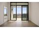 Bedroom view with hardwood floors, floor-to-ceiling windows and balcony access with a city view at 2425 Peachtree Ne Rd # 1604, Atlanta, GA 30305