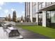 Outdoor grilling area featuring stainless steel appliances with green space and city views at 2425 Peachtree Ne Rd # 1604, Atlanta, GA 30305