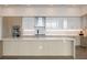 Modern kitchen with white countertops, light wood cabinets, and stainless steel appliances at 2425 Peachtree Ne Rd # 1604, Atlanta, GA 30305