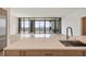 Modern kitchen with stainless steel appliances, island with sink, and a view of the city skyline at 2425 Peachtree Ne Rd # 1604, Atlanta, GA 30305