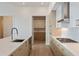 Bright kitchen featuring stainless steel appliances, light wood cabinets, and a view into a second kitchen at 2425 Peachtree Ne Rd # 1604, Atlanta, GA 30305