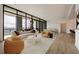 Open-concept living area with modern furniture, large windows, and city views at 2425 Peachtree Ne Rd # 1604, Atlanta, GA 30305
