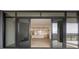 A view through sliding glass doors that leads to a bright, modern living space with an open kitchen at 2425 Peachtree Ne Rd # 1604, Atlanta, GA 30305