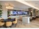 Modern lounge area with a large screen, poker table, breakfast bar, and comfortable seating at 2425 Peachtree Ne Rd # 1604, Atlanta, GA 30305