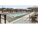 Outdoor swimming pool area with lounge chairs and umbrellas for residents and guests at 2425 Peachtree Ne Rd # 1604, Atlanta, GA 30305