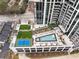 An aerial view of the rooftop pool and recreation deck at modern condominium building at 2425 Peachtree Ne Rd # 1604, Atlanta, GA 30305