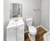 Well-lit bathroom features a classic vanity and a toilet at 4540 Flat Willow Pl, Douglasville, GA 30135