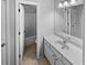 Bathroom with a single sink vanity and a door leading to the toilet and shower at 4540 Flat Willow Pl, Douglasville, GA 30135