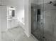 Modern bathroom with a glass-enclosed shower, vanity with sink, and a soaking tub at 4540 Flat Willow Pl, Douglasville, GA 30135