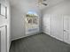 Bedroom with a large window providing ample natural light and a double-door closet at 4540 Flat Willow Pl, Douglasville, GA 30135